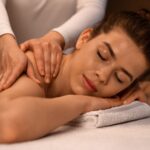 Home woman getting healing body massage session at newest spa.jpg